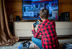 Boy playing an online video game at home