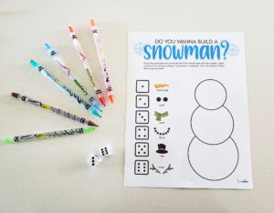 Roll A Snowman Game with dice and crayons