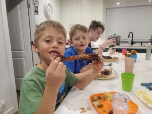 My boys eating dinner and attempting to use their manners.