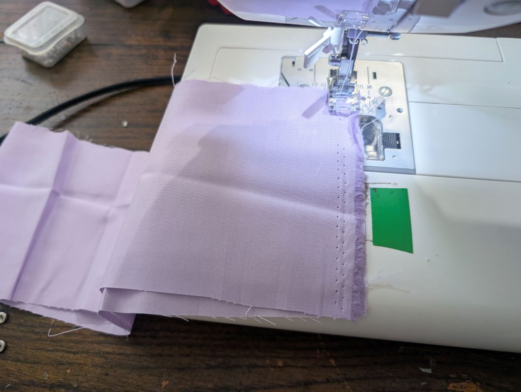 Fold right sides together and sew the short end.