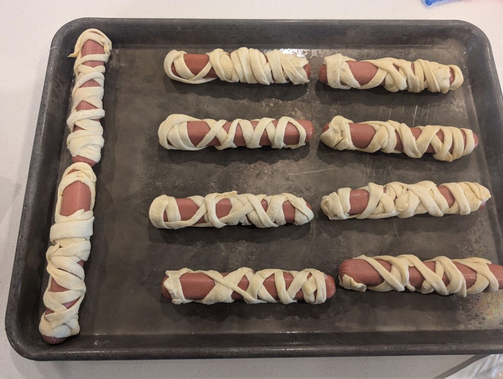 Mummy hot dogs ready to be cooked