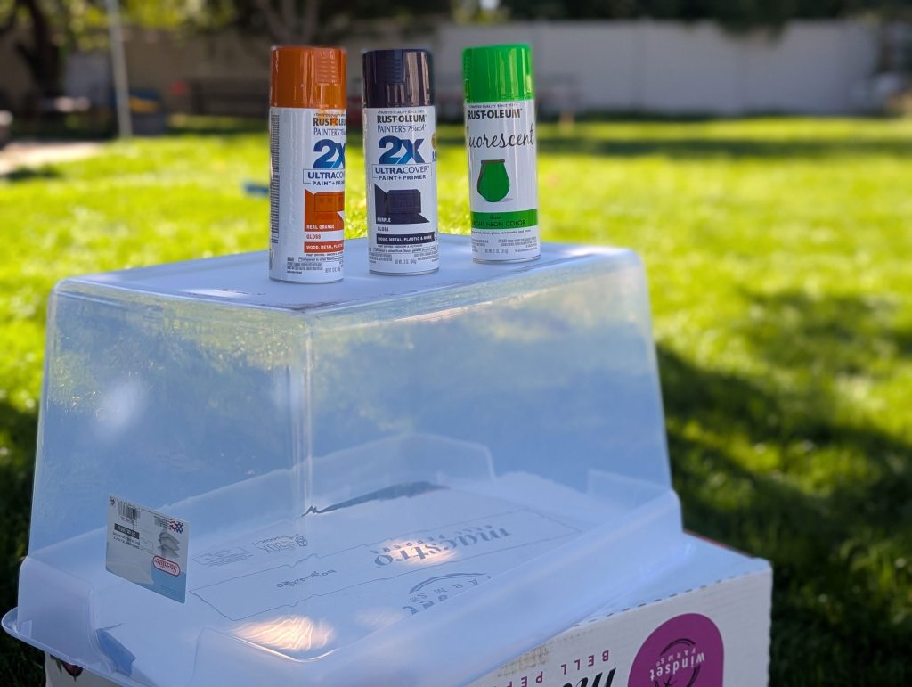 Spray paint each storage bin with a different Halloween color