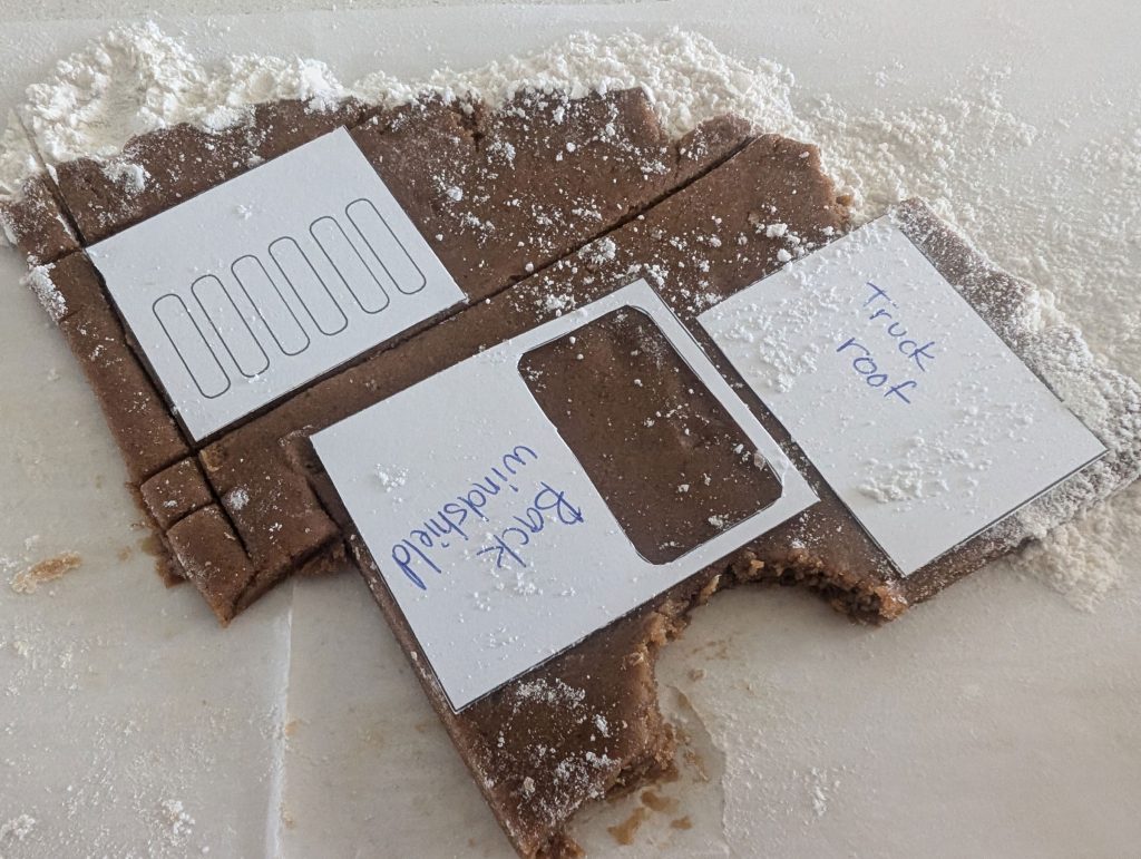 Cutting out each shape into the gingerbread dough
