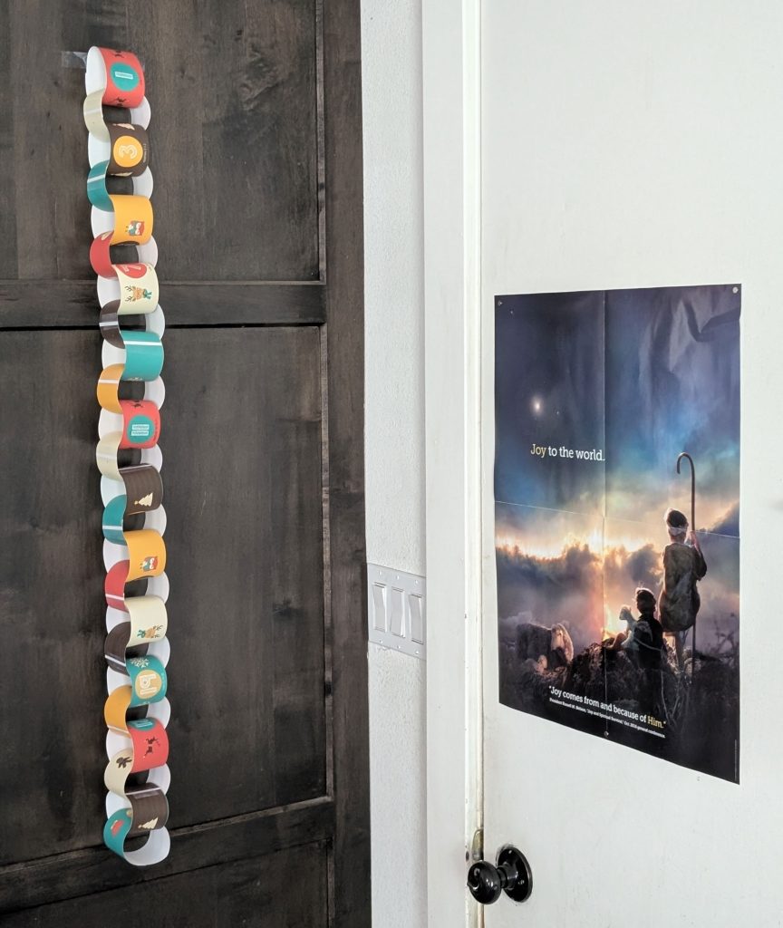 Our Christmas countdown hanging by our garage door