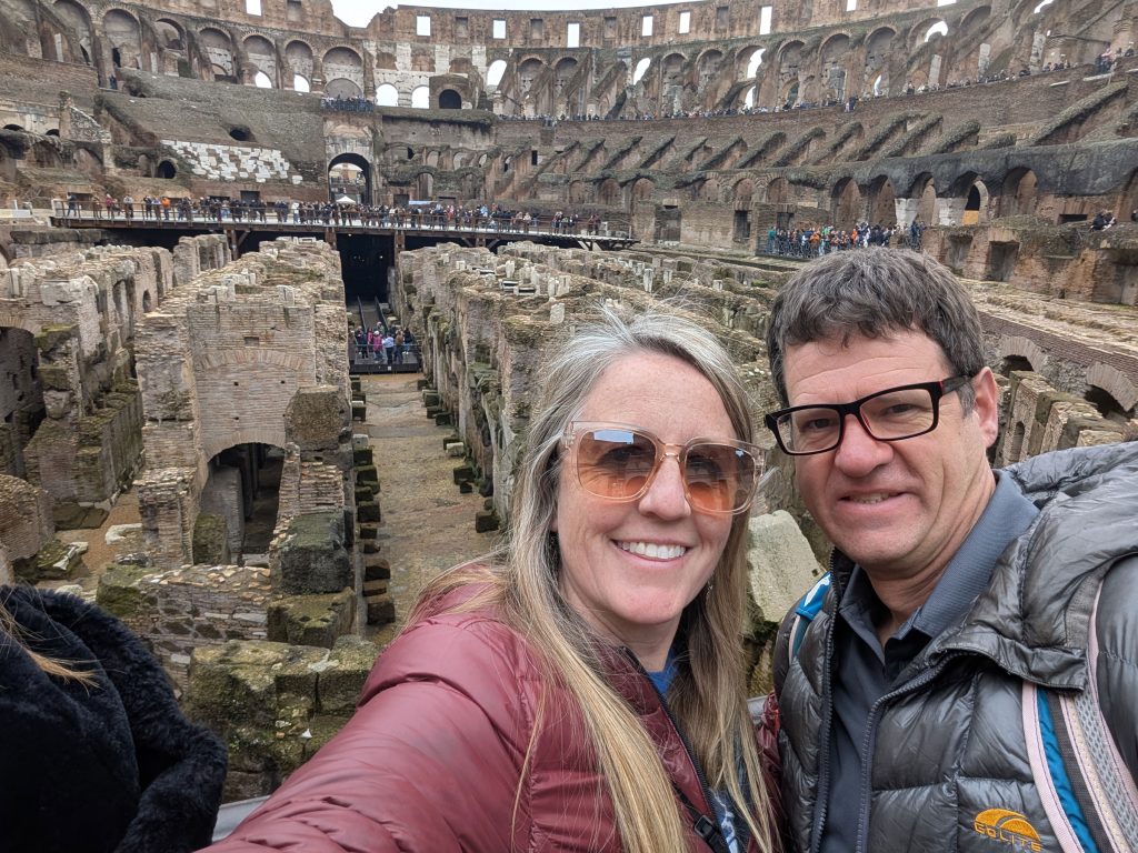 My husband and I visiting the Colosseum in Rome