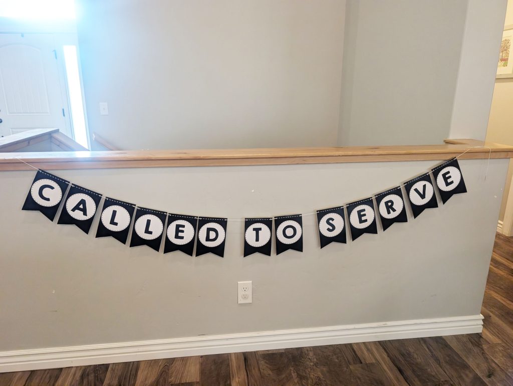 Our banner hanging up on our half wall in the living room