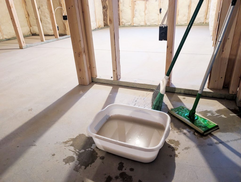 Mop and sweep your concrete before beginning the staining process