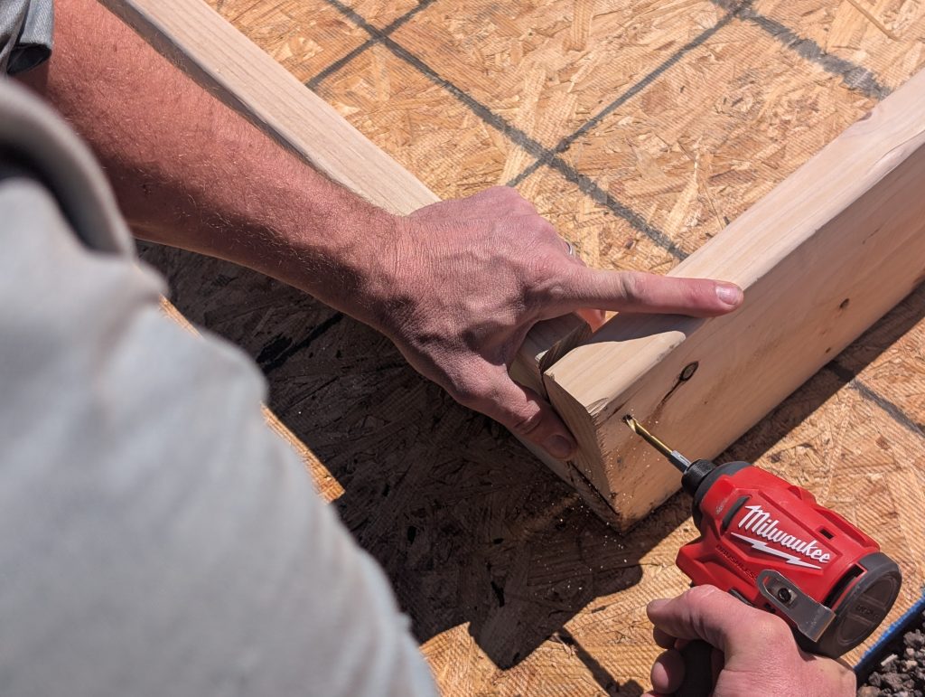 Drilling a pilot hole before screwing in the wood screws