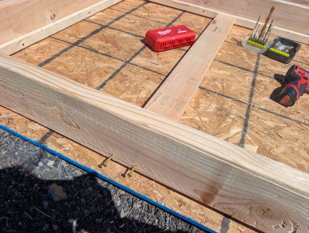 Screwing the 2x4s to the frame