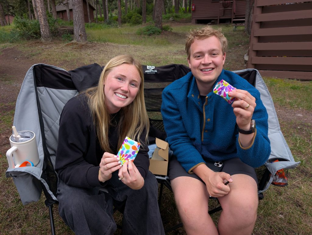 My niece and her husband holding their gifts for the game