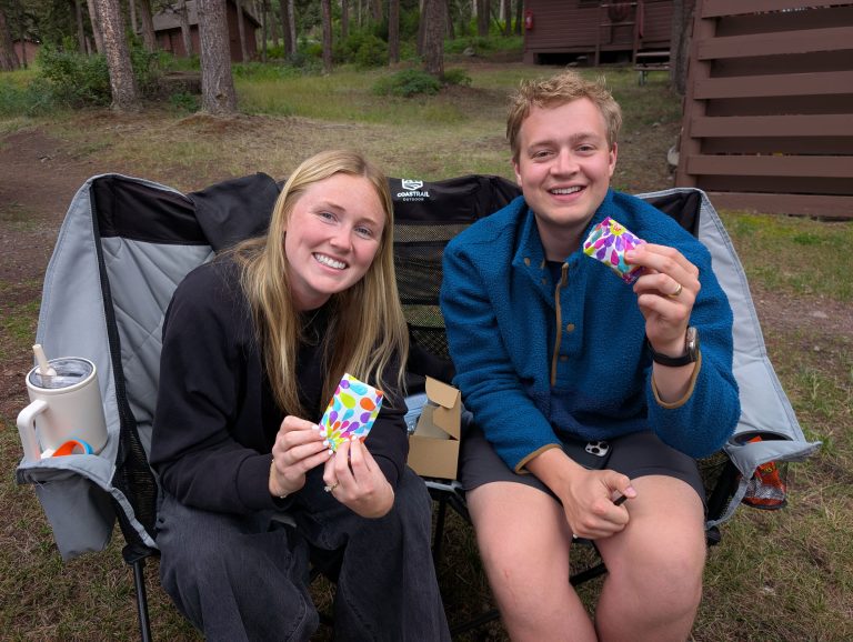 My niece and her husband holding their gifts for the game